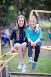 Students perched on a playground structure