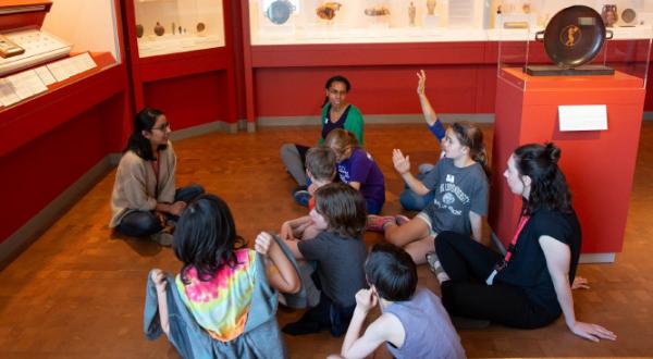Students learning at a museum